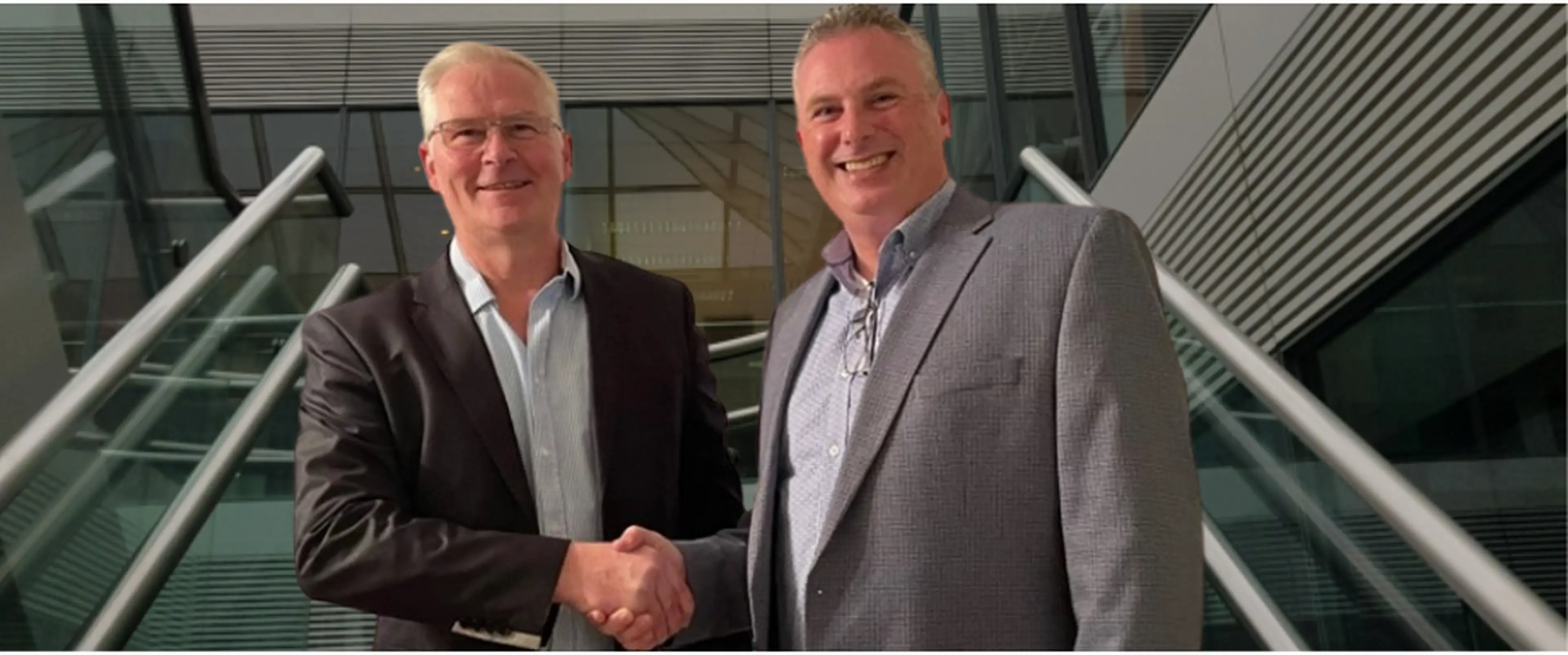 Karl Andersson, VP of Development and Acquisitions Glantus Holdings Plc and Peter Welch, Managing Director Meridian Cost Benefit Ltd celebrating the acquisition. 